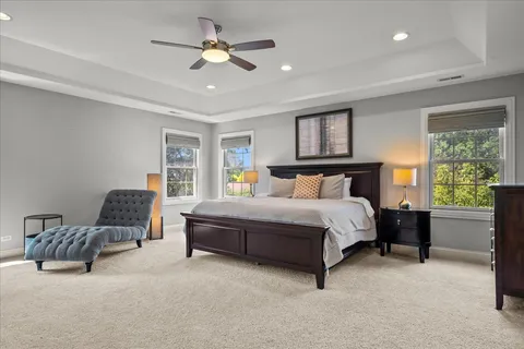 a bedroom with a bed couch and window