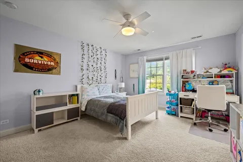 a bedroom with bed and a window