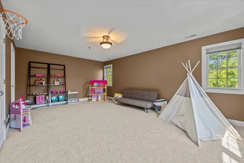 a view of livingroom with furniture and toys