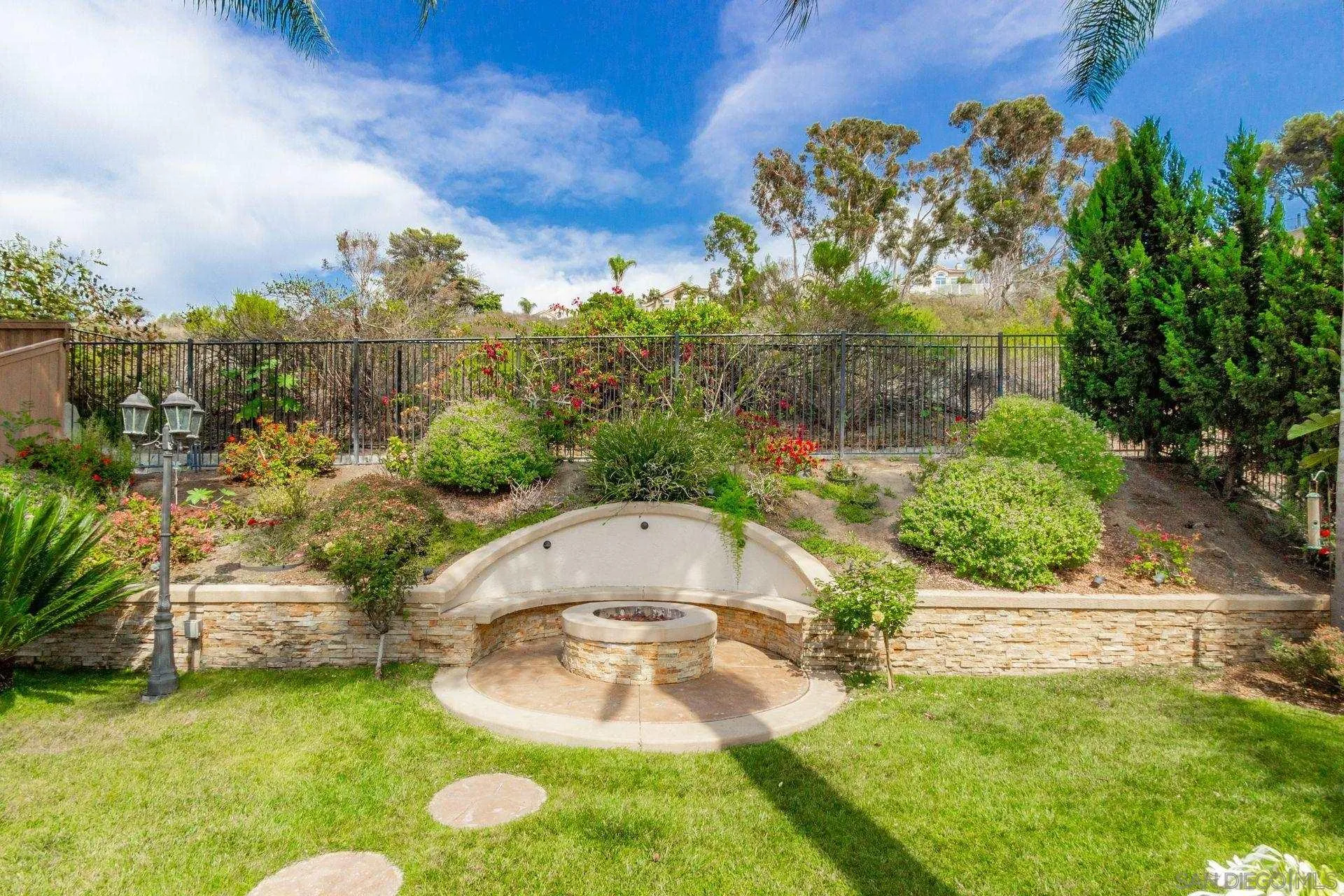302 La Soledad Way Oceanside, CA 92057 - Photo 11 of 37 a view of a garden with a fountain