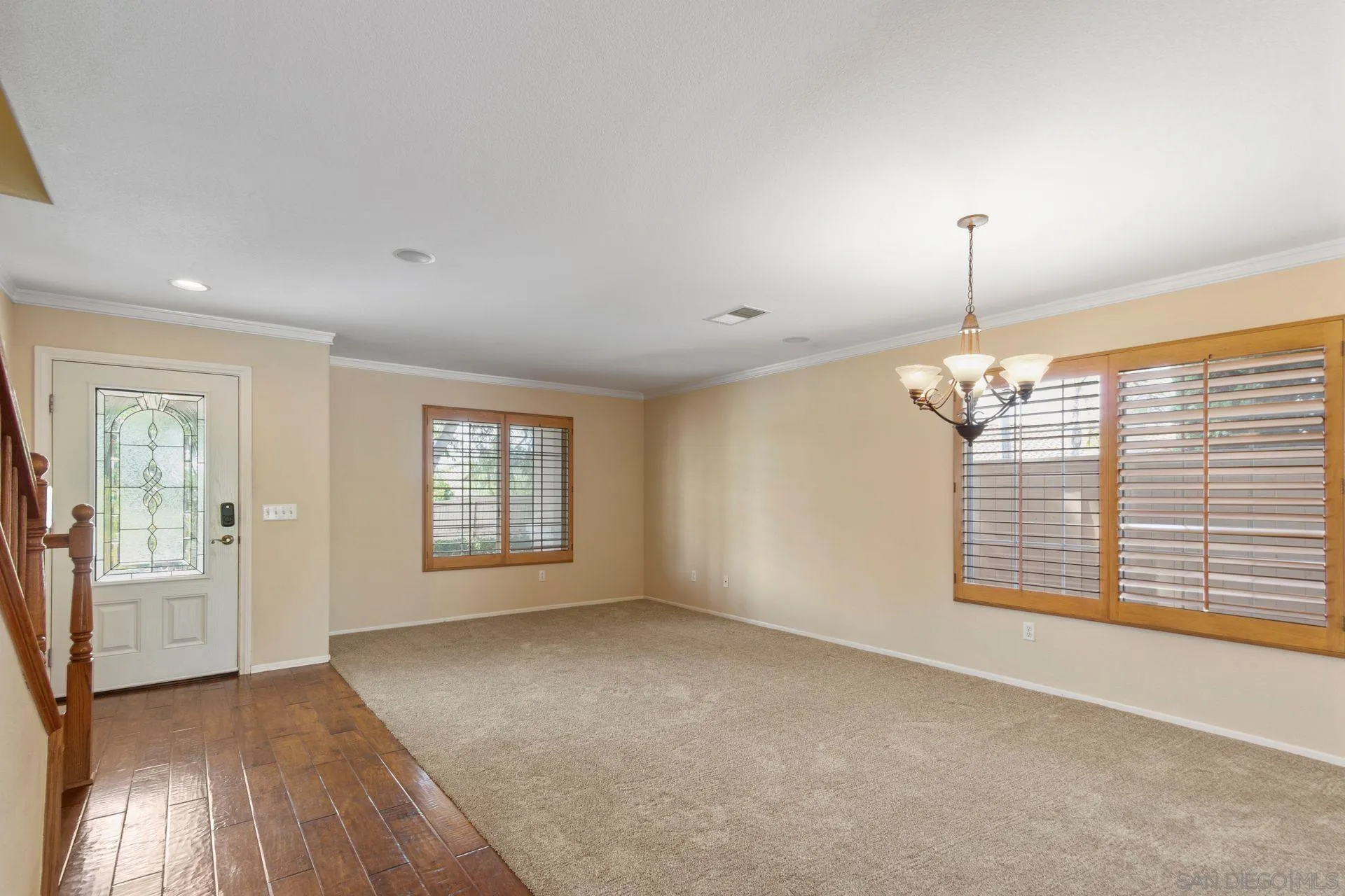 302 La Soledad Way Oceanside, CA 92057 - Photo 17 of 37 an empty room with windows and chandelier