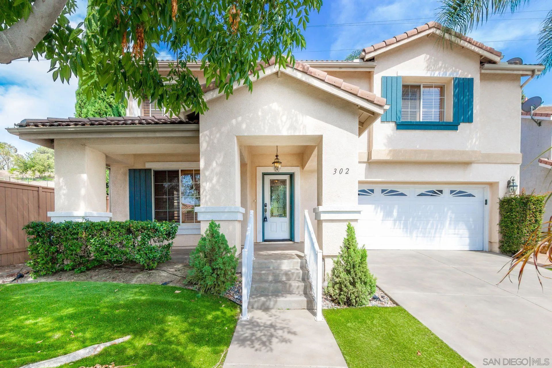 302 La Soledad Way Oceanside, CA 92057 - Photo 2 of 37 a front view of a house with garden