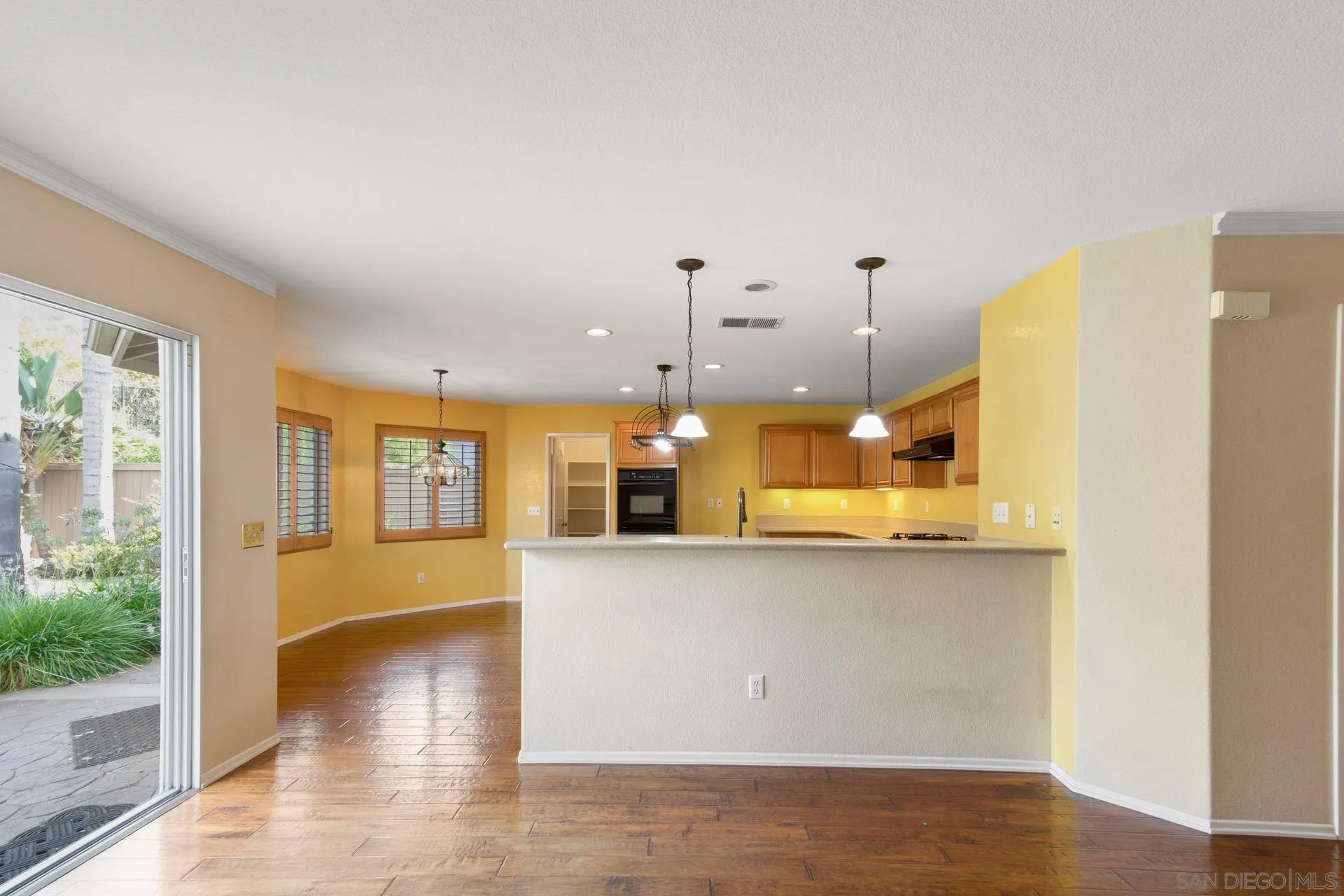 302 La Soledad Way Oceanside, CA 92057 - Photo 22 of 37 a view of a kitchen with wooden floor and a window