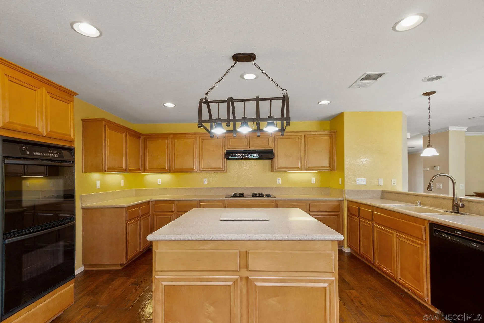 302 La Soledad Way Oceanside, CA 92057 - Photo 24 of 37 a kitchen with a sink a stove and cabinets