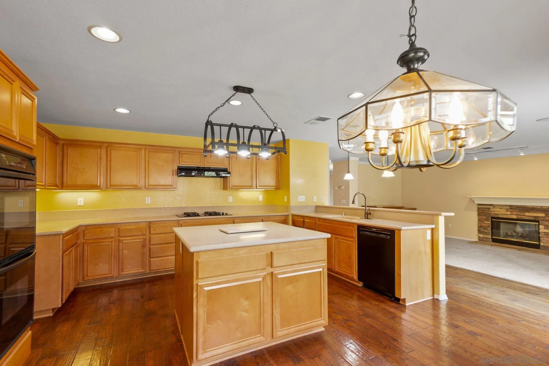 302 La Soledad Way Oceanside, CA 92057 - Photo 25 of 37 a kitchen that has a stove and a table