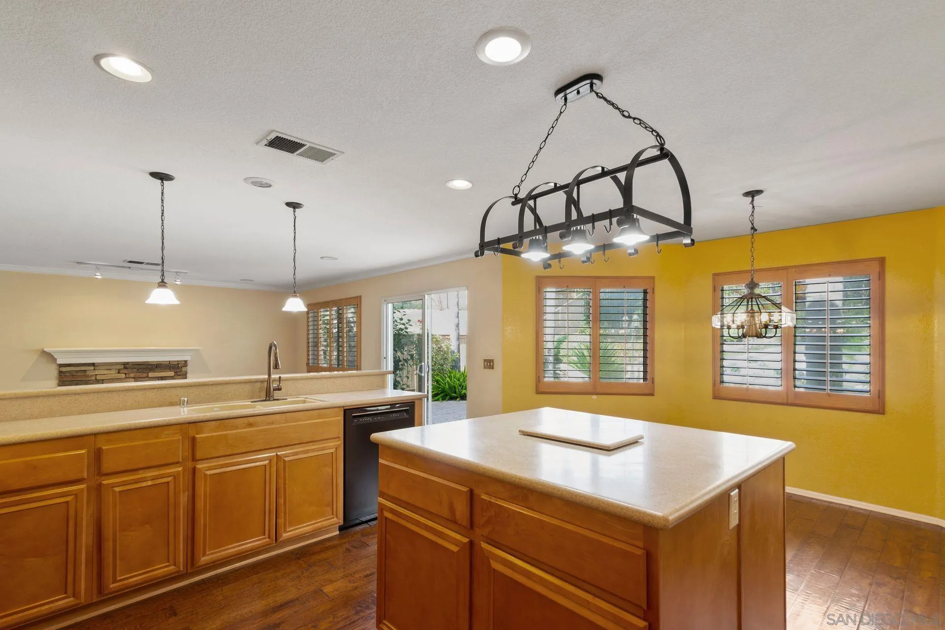 302 La Soledad Way Oceanside, CA 92057 - Photo 27 of 37 a kitchen with a sink a counter and appliances