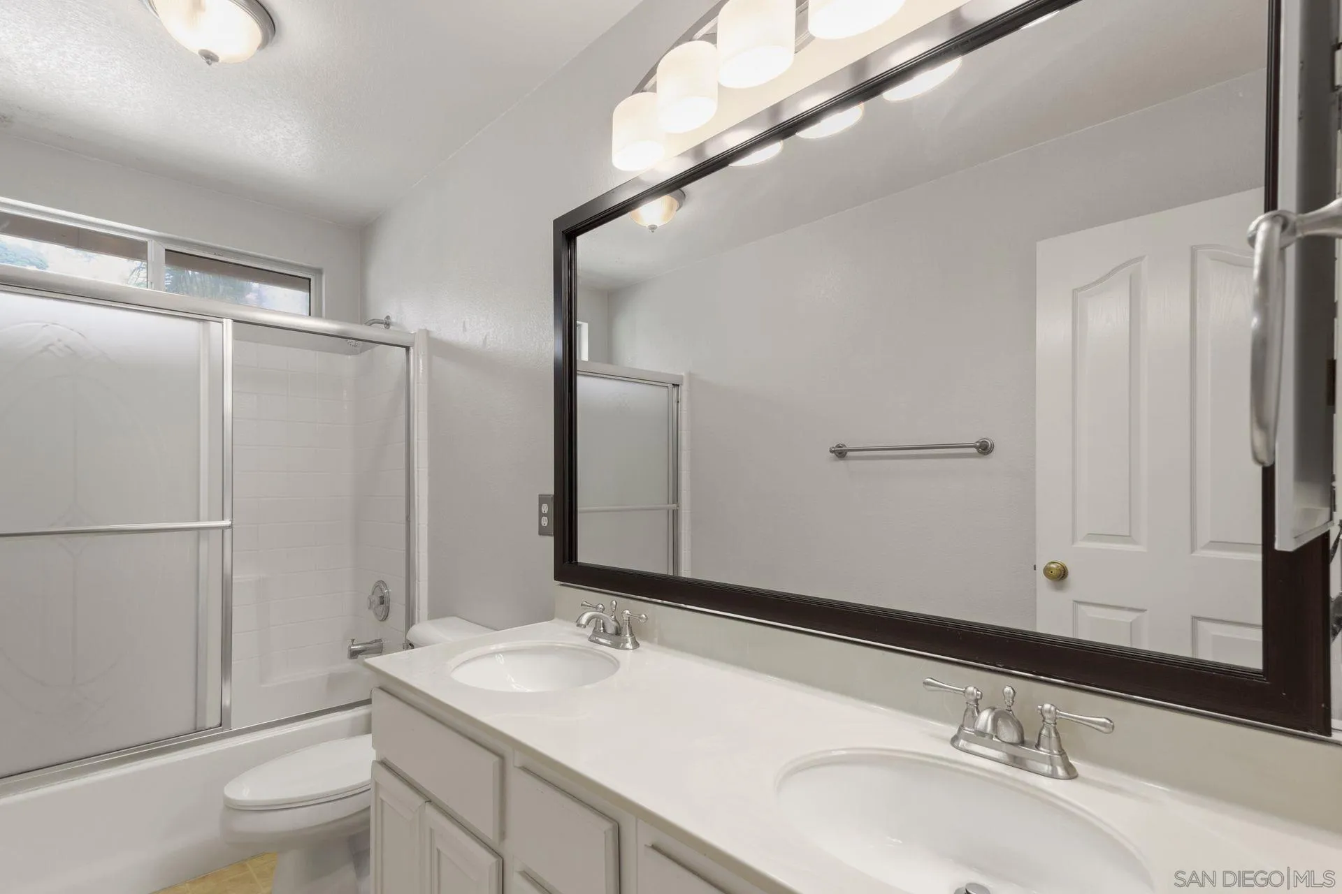 302 La Soledad Way Oceanside, CA 92057 - Photo 30 of 37 a bathroom with a sink and a mirror