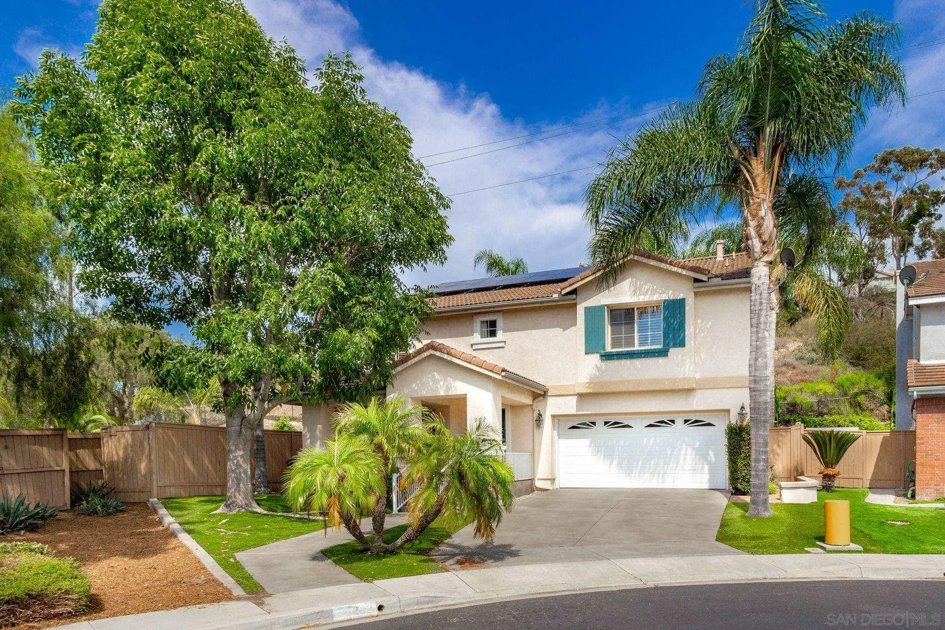 302 La Soledad Way Oceanside, CA 92057 - Photo 3 of 37 a front view of a house with a garden