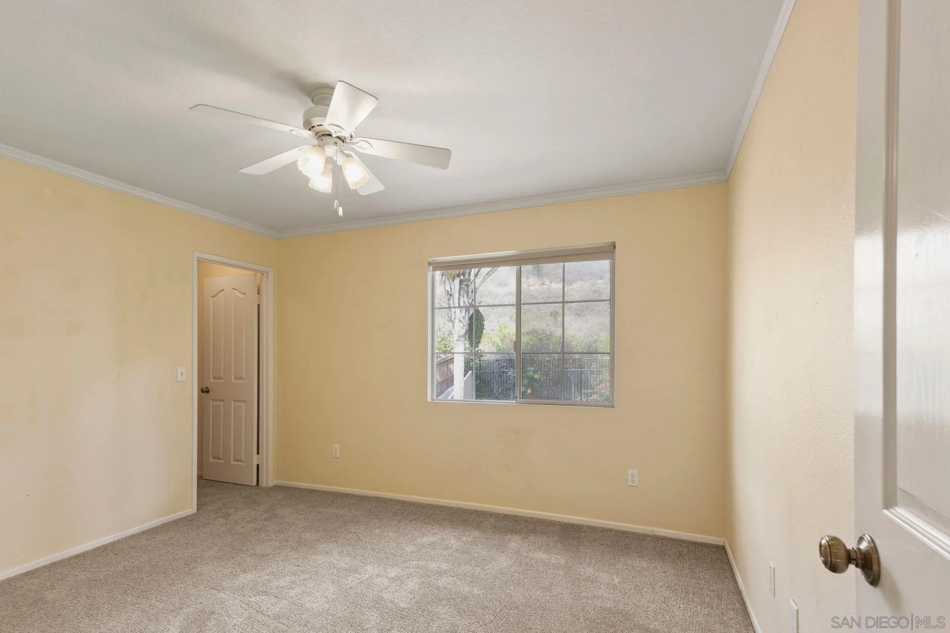 302 La Soledad Way Oceanside, CA 92057 - Photo 31 of 37 an empty room with windows and fan