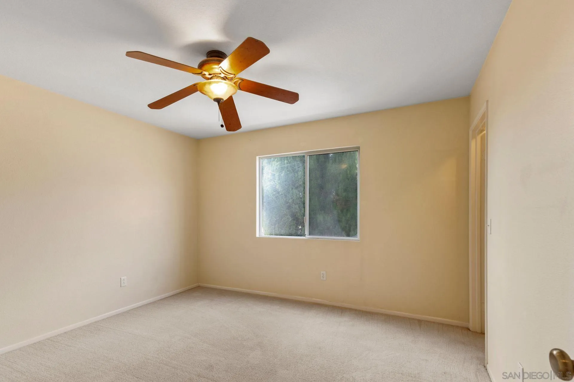 302 La Soledad Way Oceanside, CA 92057 - Photo 32 of 37 a view of a room with a ceiling fan and a window