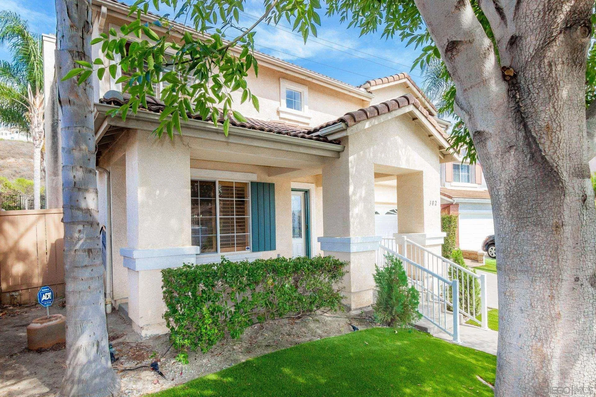 302 La Soledad Way Oceanside, CA 92057 - Photo 6 of 37 front view of a house with a yard