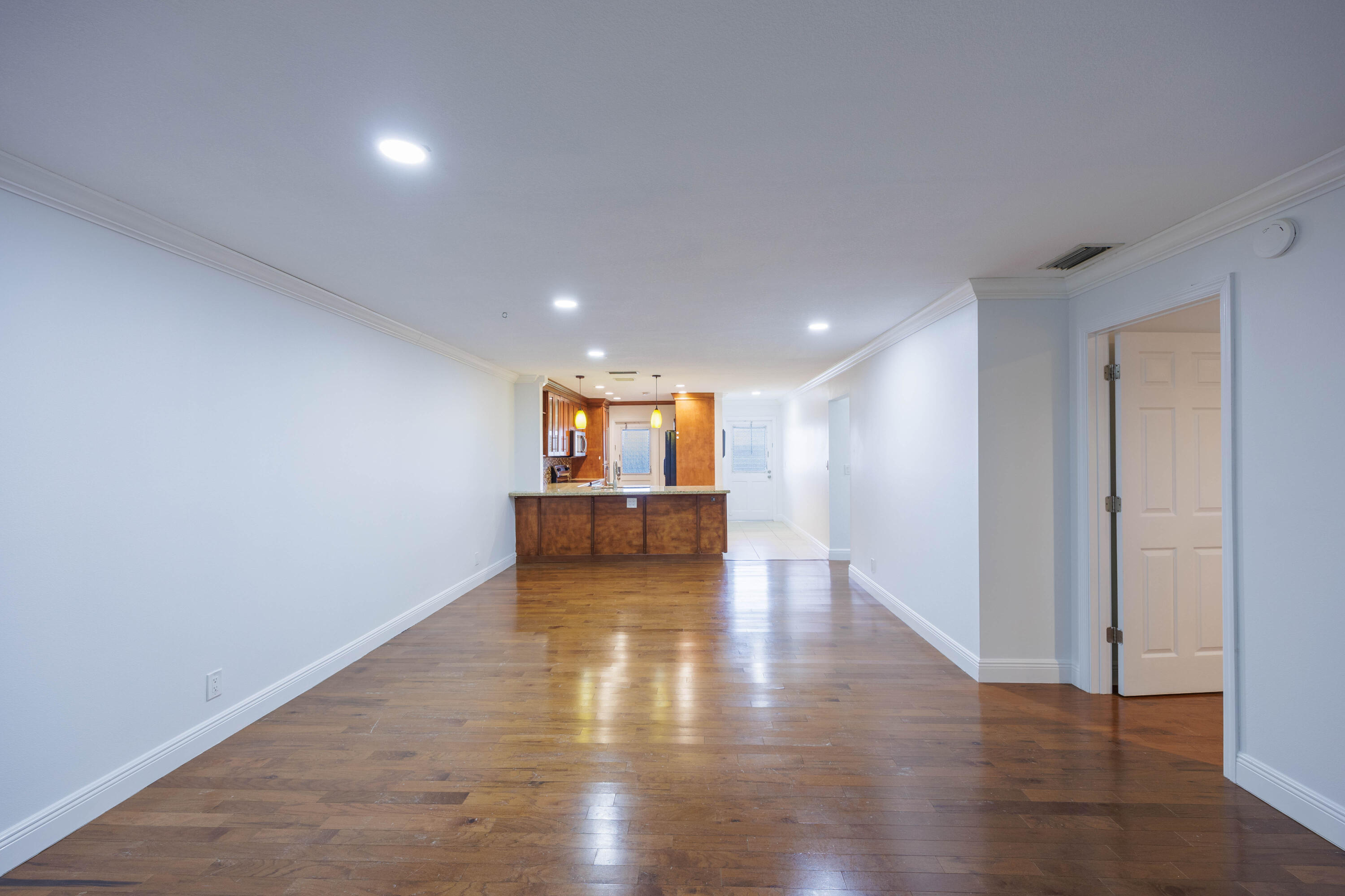 3001 Linton Boulevard, Unit 213C Delray Beach, FL 33445 - Photo 14 of 35 a view of empty room with wooden floor
