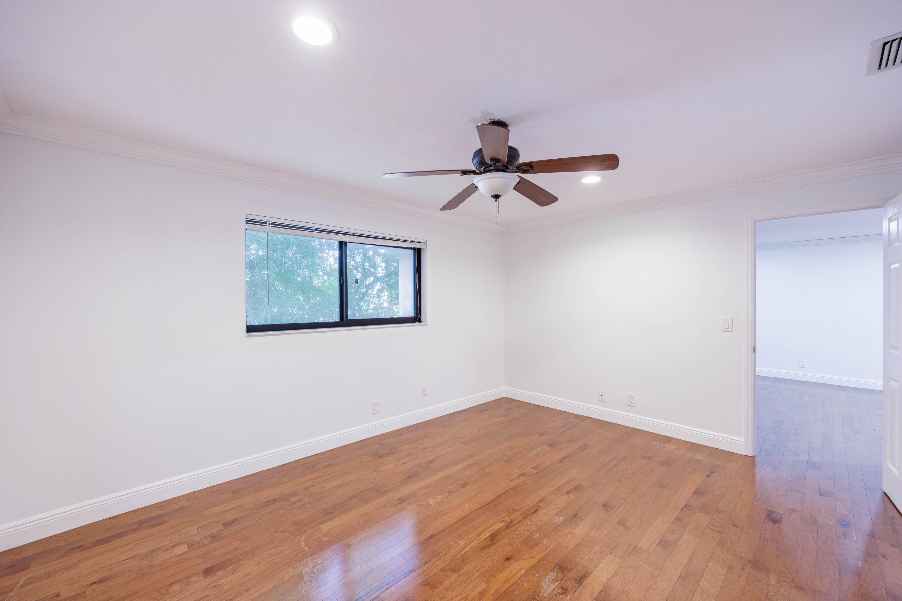 3001 Linton Boulevard, Unit 213C Delray Beach, FL 33445 - Photo 16 of 35 a view of a big room with wooden floor and windows