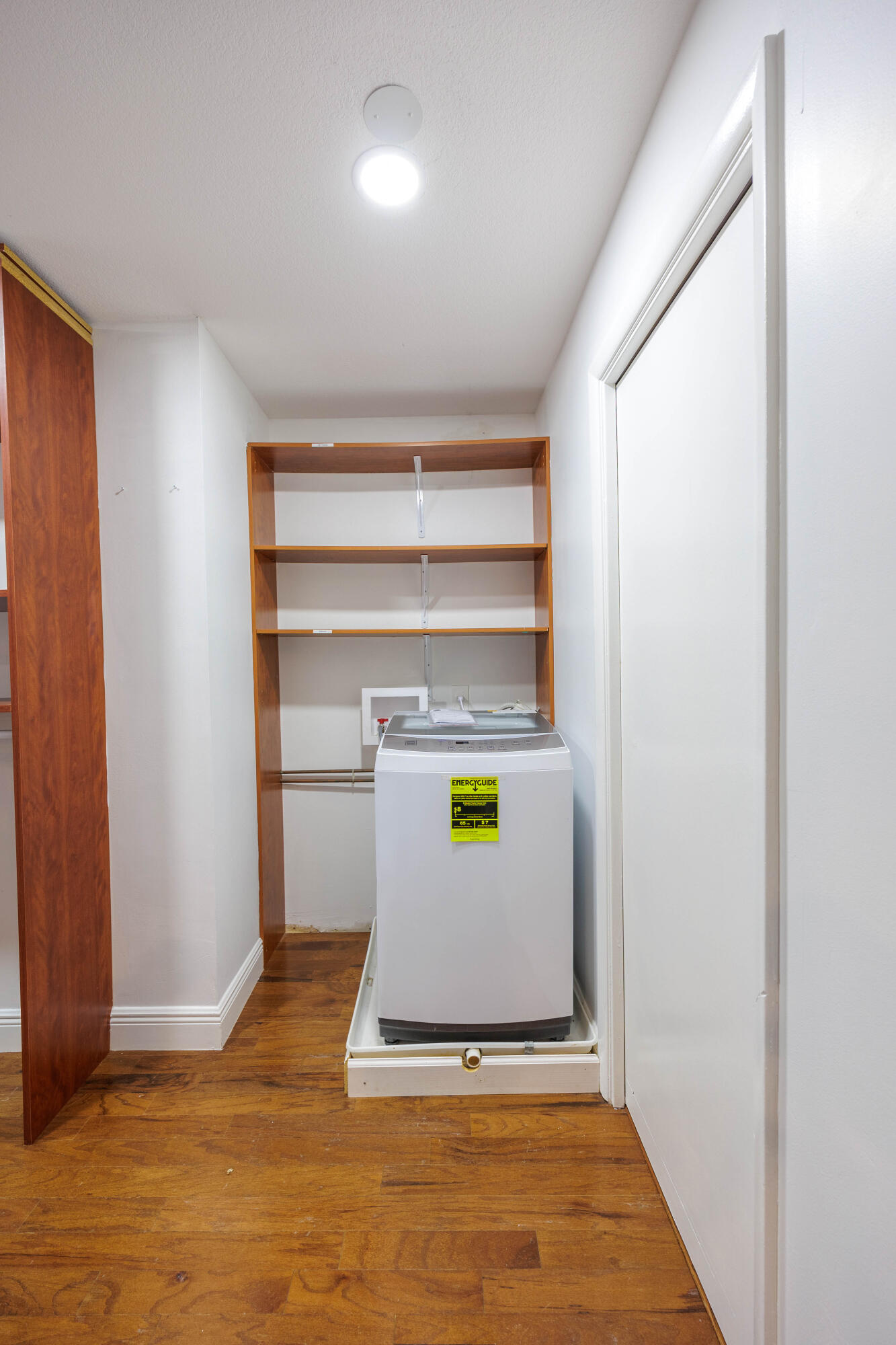 3001 Linton Boulevard, Unit 213C Delray Beach, FL 33445 - Photo 17 of 35 a view of an empty room with wooden floor and a window