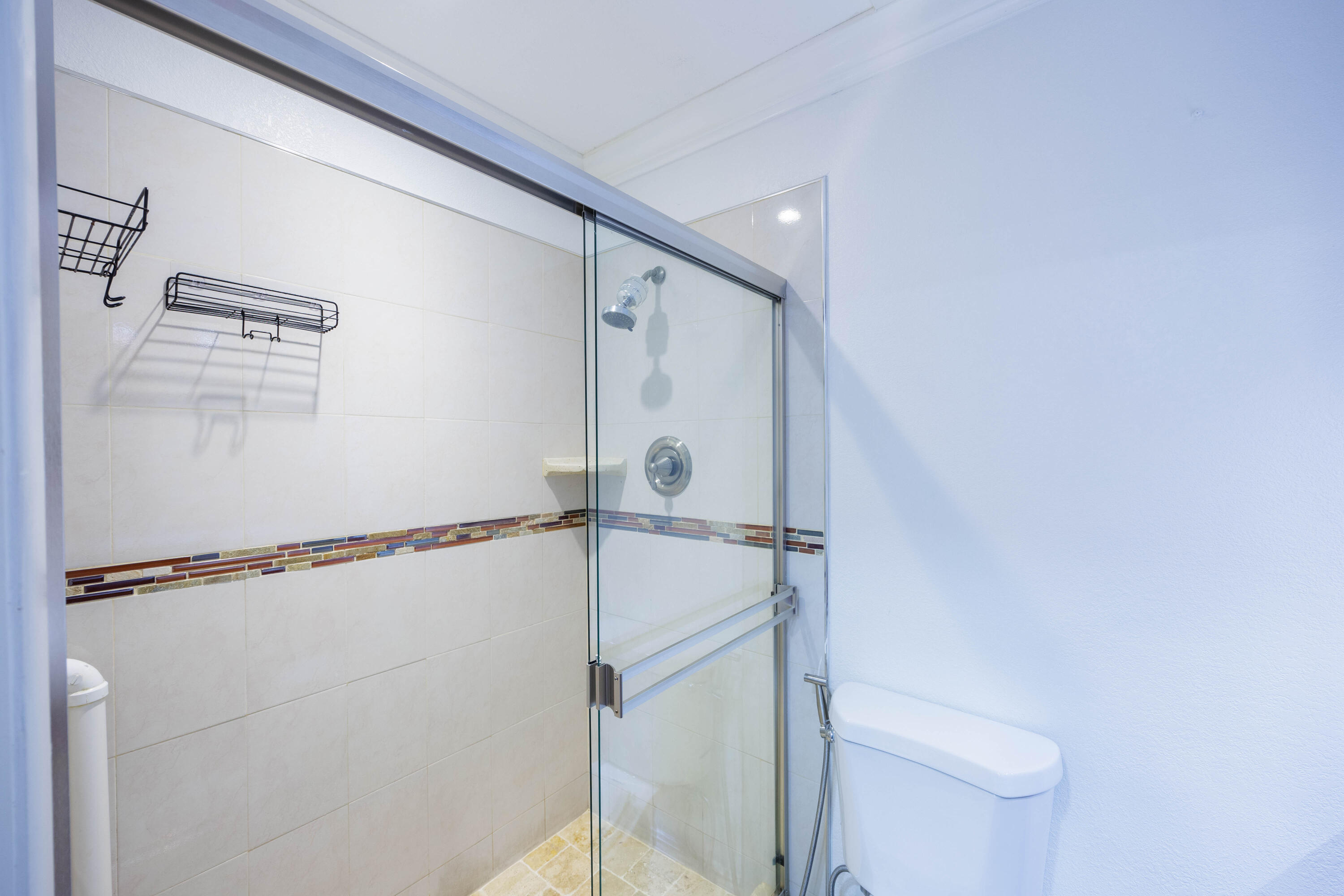 3001 Linton Boulevard, Unit 213C Delray Beach, FL 33445 - Photo 21 of 35 a bathroom with a shower and a toilet