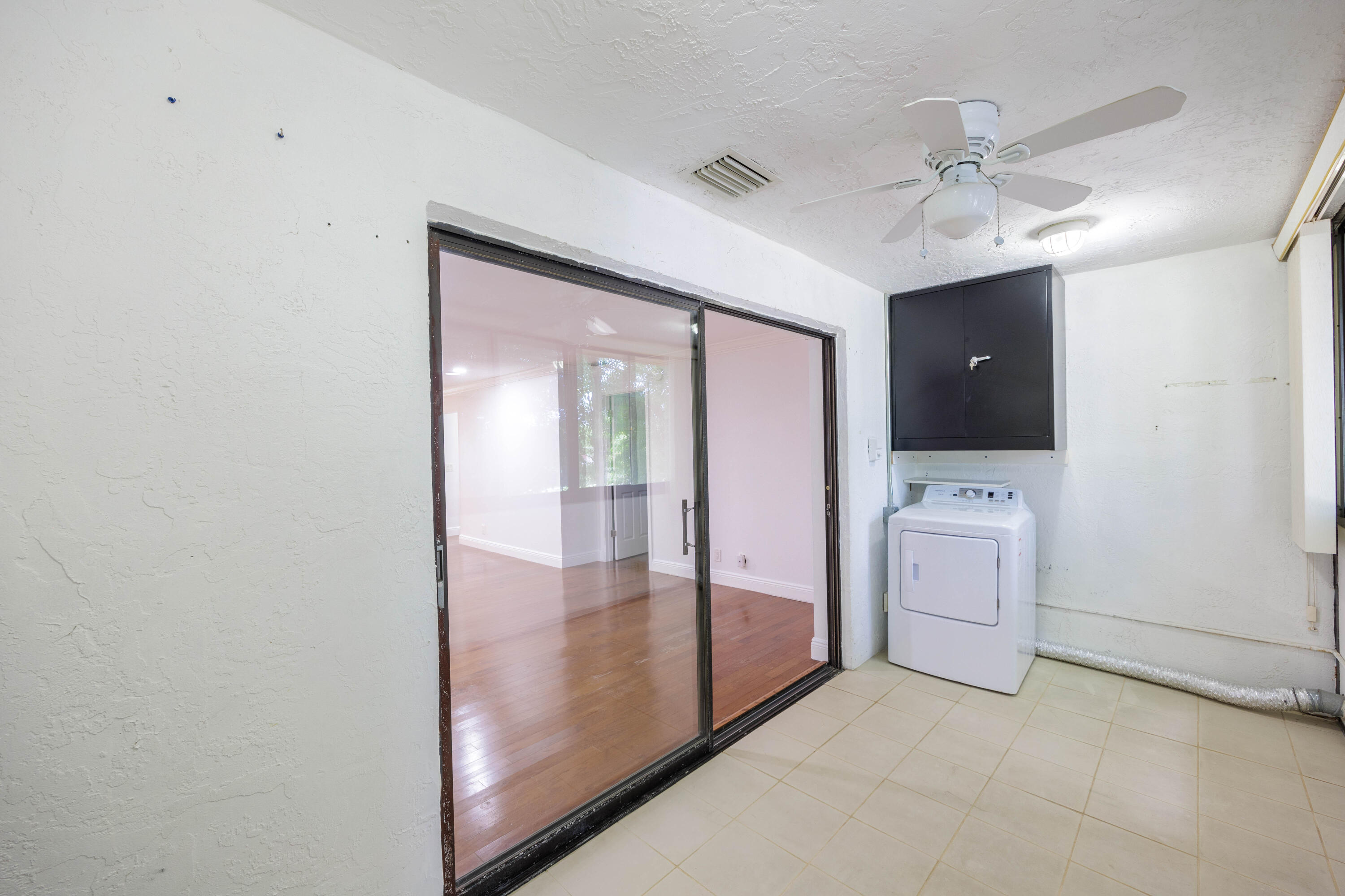 3001 Linton Boulevard, Unit 213C Delray Beach, FL 33445 - Photo 24 of 35 a view of a hallway with a bathroom