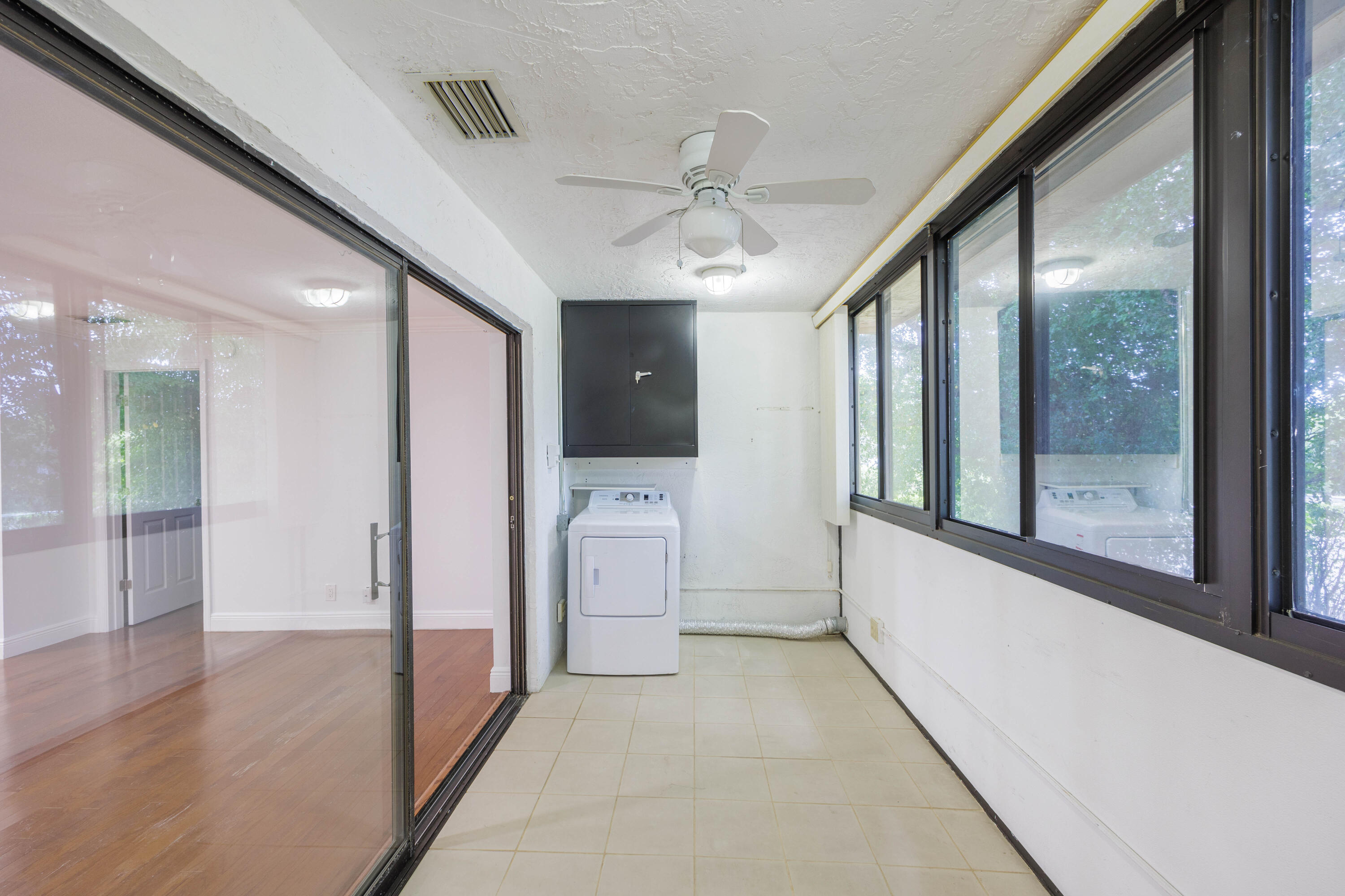 3001 Linton Boulevard, Unit 213C Delray Beach, FL 33445 - Photo 25 of 35 a view of hallway with stainless steel appliances granite countertop furniture and a large window