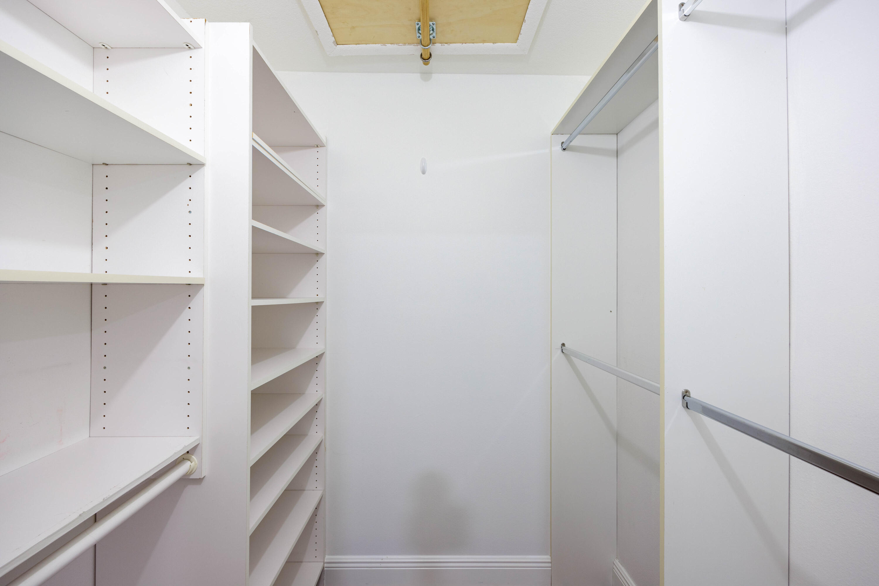 3001 Linton Boulevard, Unit 213C Delray Beach, FL 33445 - Photo 26 of 35 a view of walk in closet with empty racks
