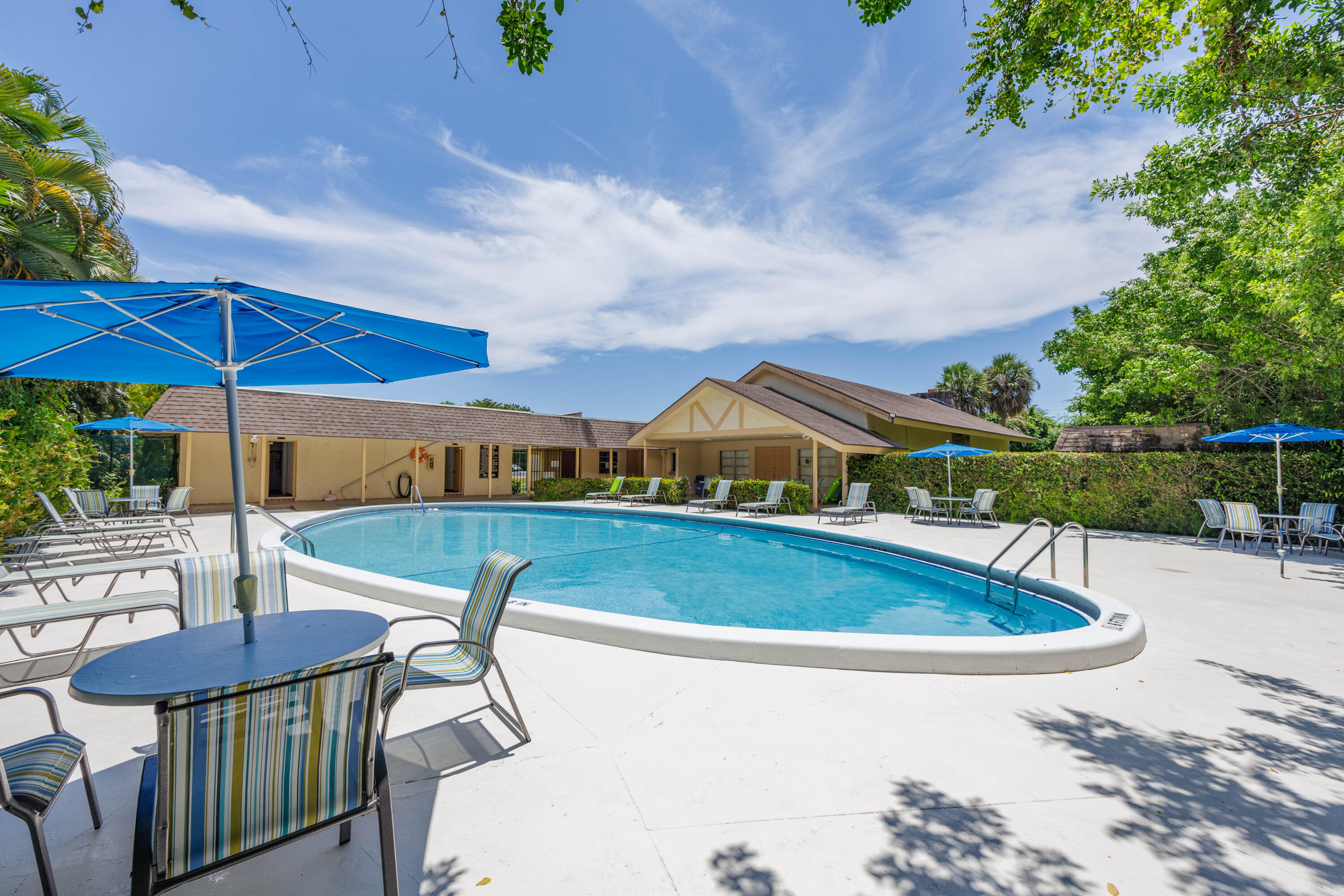 3001 Linton Boulevard, Unit 213C Delray Beach, FL 33445 - Photo 33 of 35 an outdoor space with swimming pool and furniture