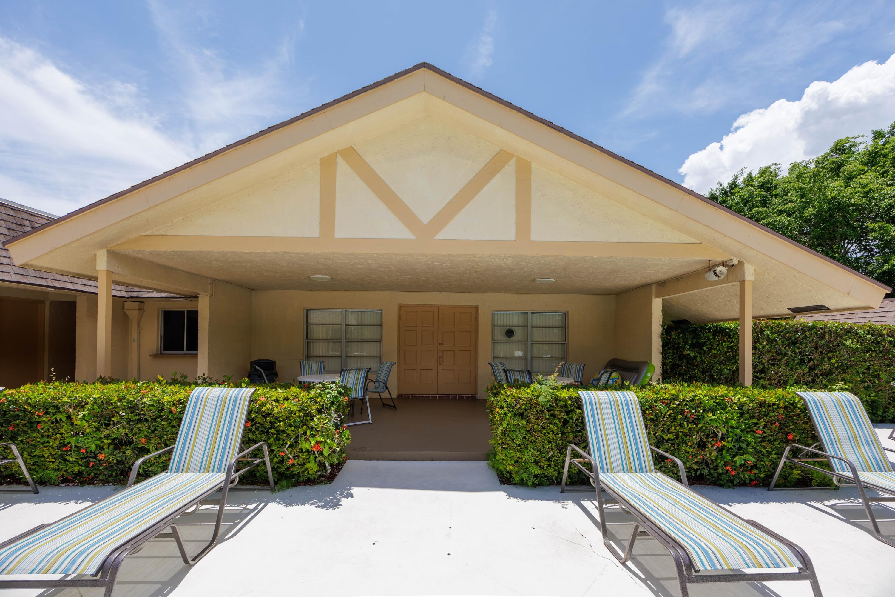 3001 Linton Boulevard, Unit 213C Delray Beach, FL 33445 - Photo 34 of 35 a front view of house with yard