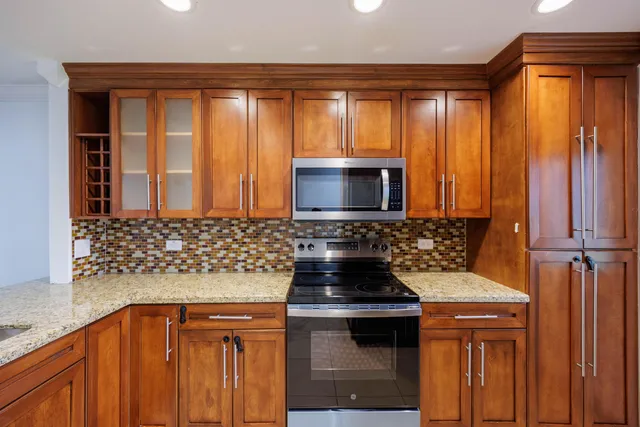 a kitchen that has a sink and a stove in it