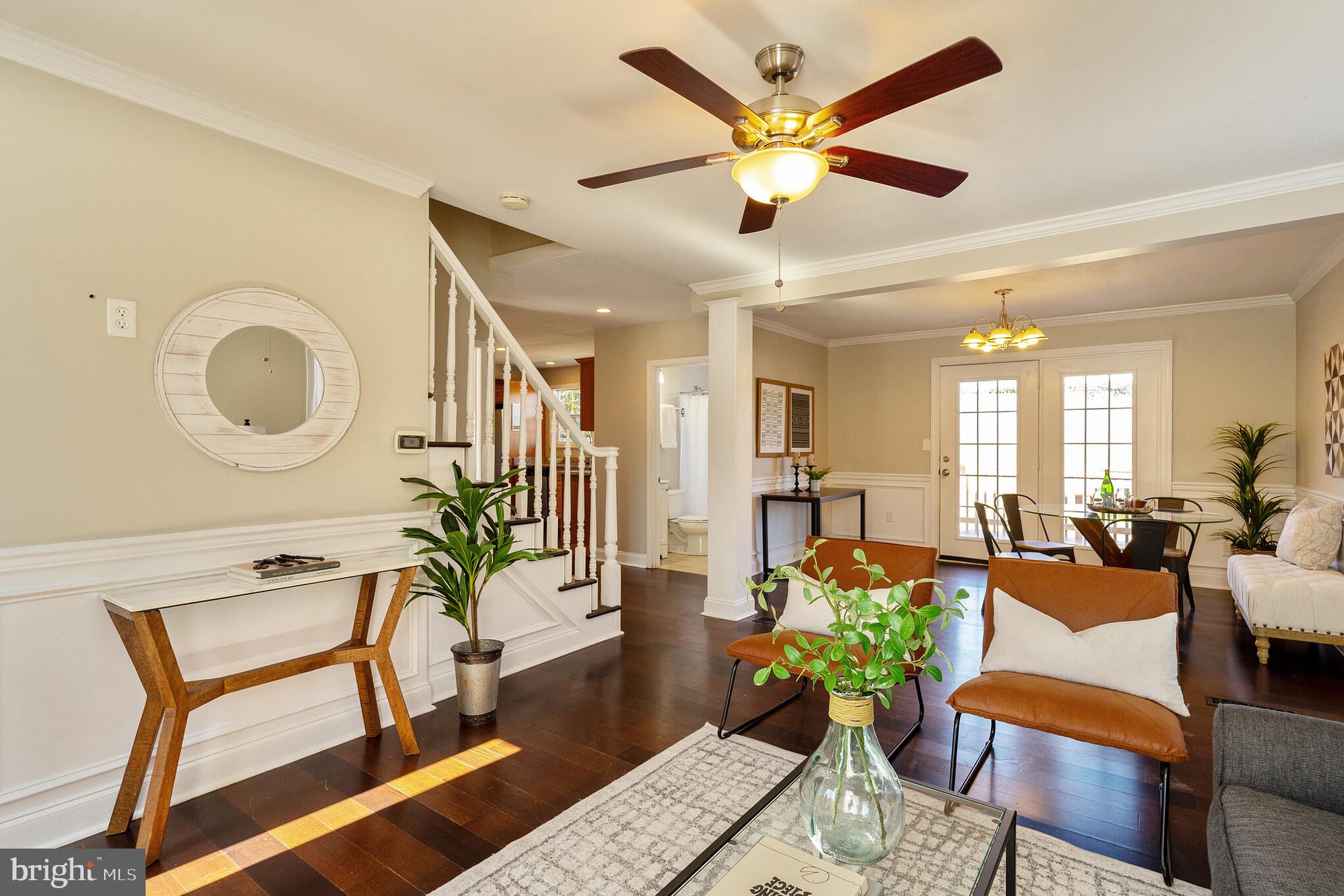 2810 Manoff Road Halethorpe, MD 21227 - Photo 3 of 27 a living room with furniture potted plant and a chandelier