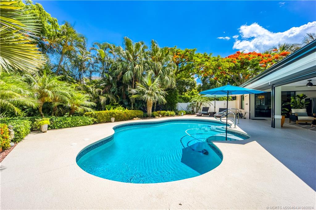 121 Hillcrest Drive Stuart, FL 34996 - Photo 16 of 65 a view of swimming pool with seating space