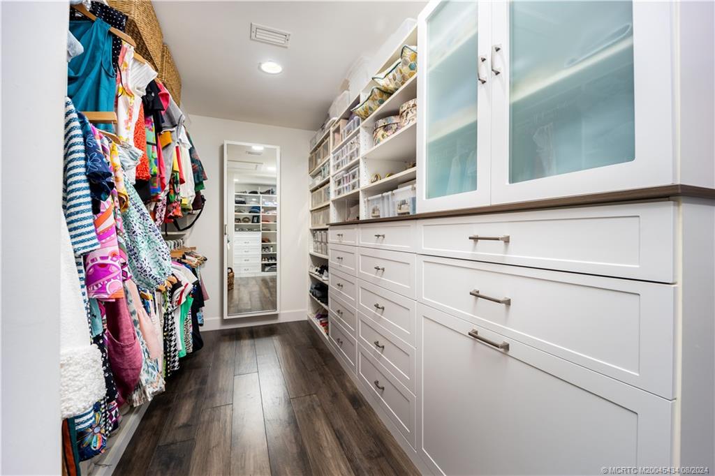 121 Hillcrest Drive Stuart, FL 34996 - Photo 29 of 65 a view of walk in closet with clothes and shoes