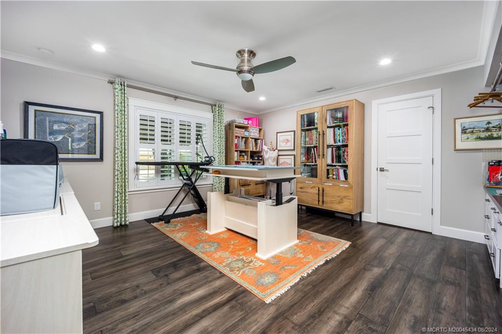 121 Hillcrest Drive Stuart, FL 34996 - Photo 34 of 65 a living room with furniture and a wooden floor