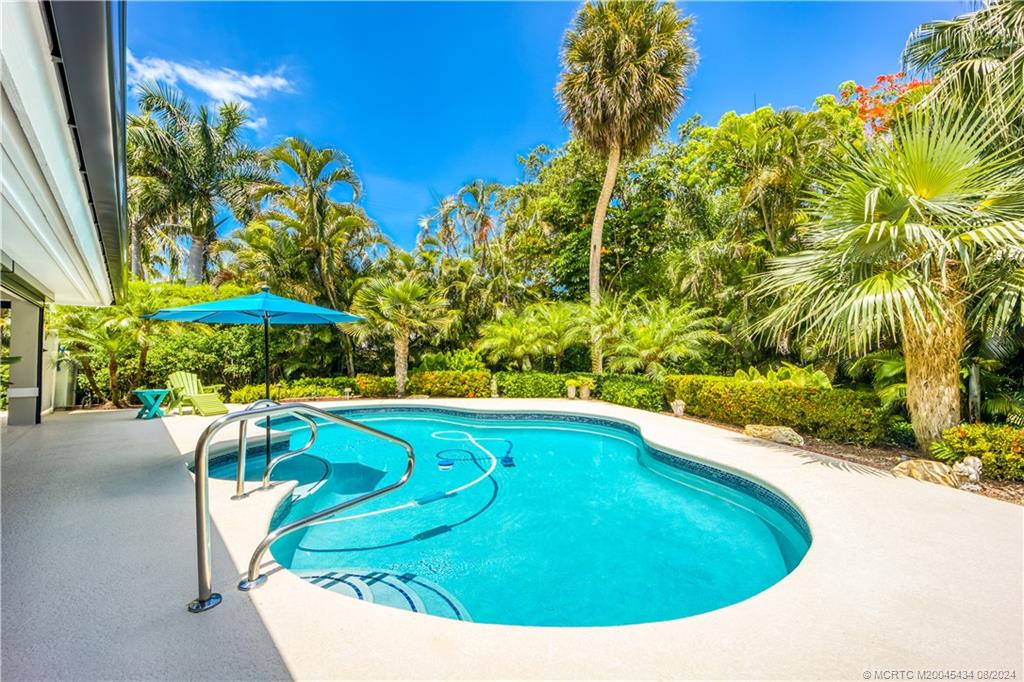 121 Hillcrest Drive Stuart, FL 34996 - Photo 48 of 65 a view of swimming pool with a yard