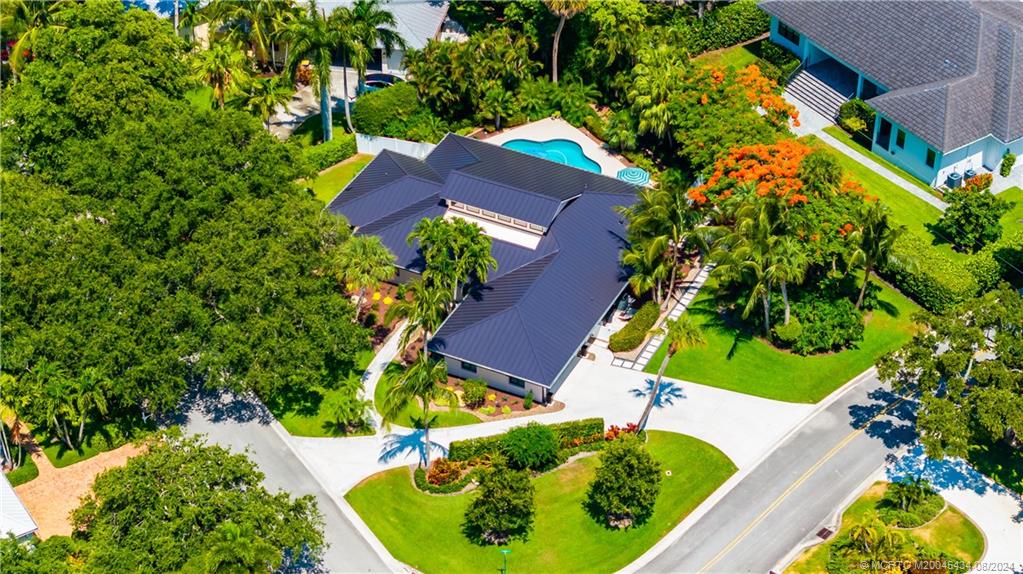 121 Hillcrest Drive Stuart, FL 34996 - Photo 5 of 65 an aerial view of a house with a yard and garden