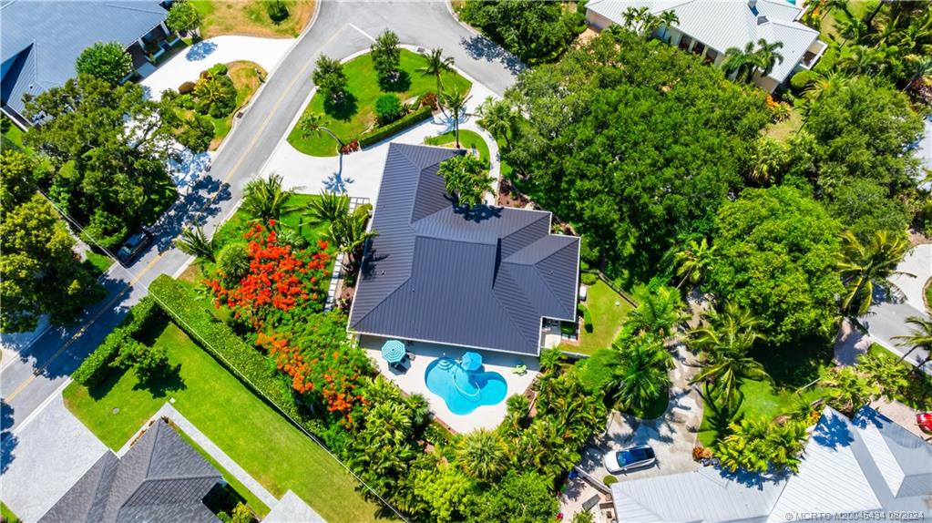 121 Hillcrest Drive Stuart, FL 34996 - Photo 55 of 65 an aerial view of a house with a yard and garden