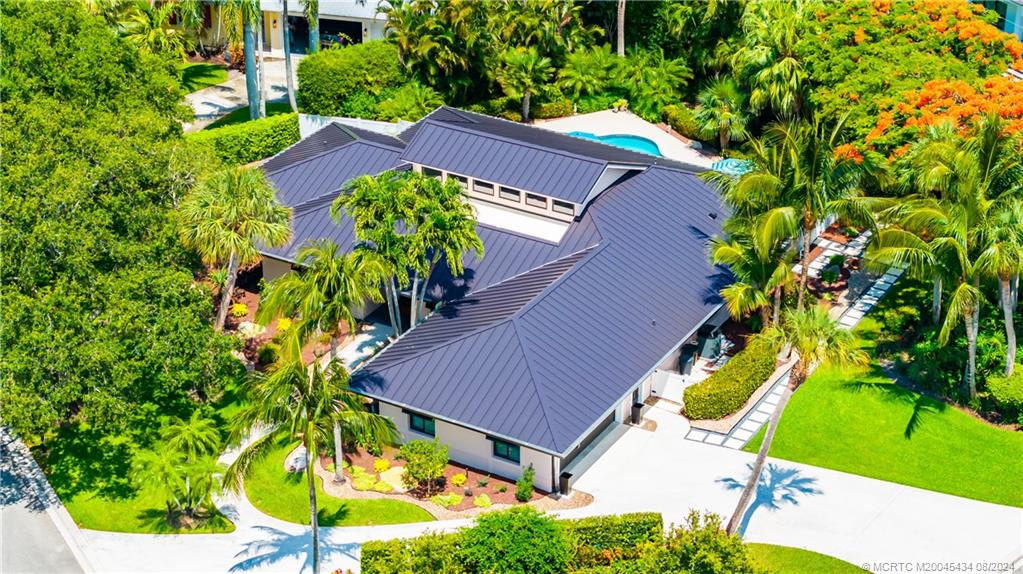 121 Hillcrest Drive Stuart, FL 34996 - Photo 57 of 65 an aerial view of a house with a yard and swimming pool