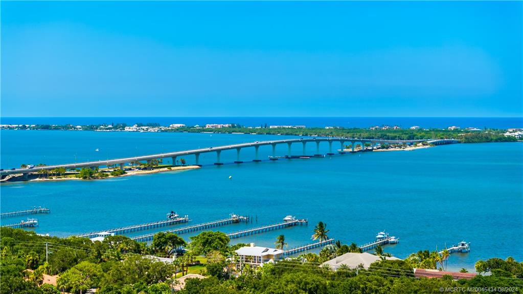 121 Hillcrest Drive Stuart, FL 34996 - Photo 60 of 65 an aerial view of a city with lots of residential buildings and ocean