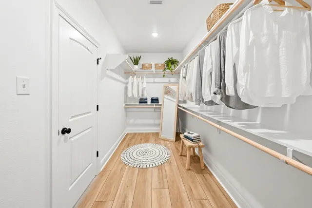 a bathroom with a sink a mirror and a shower