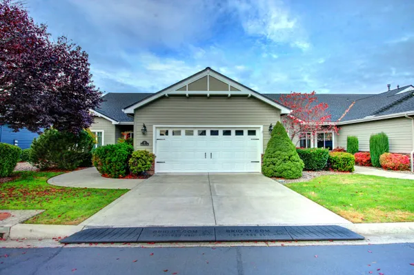 a front view of a house with yard