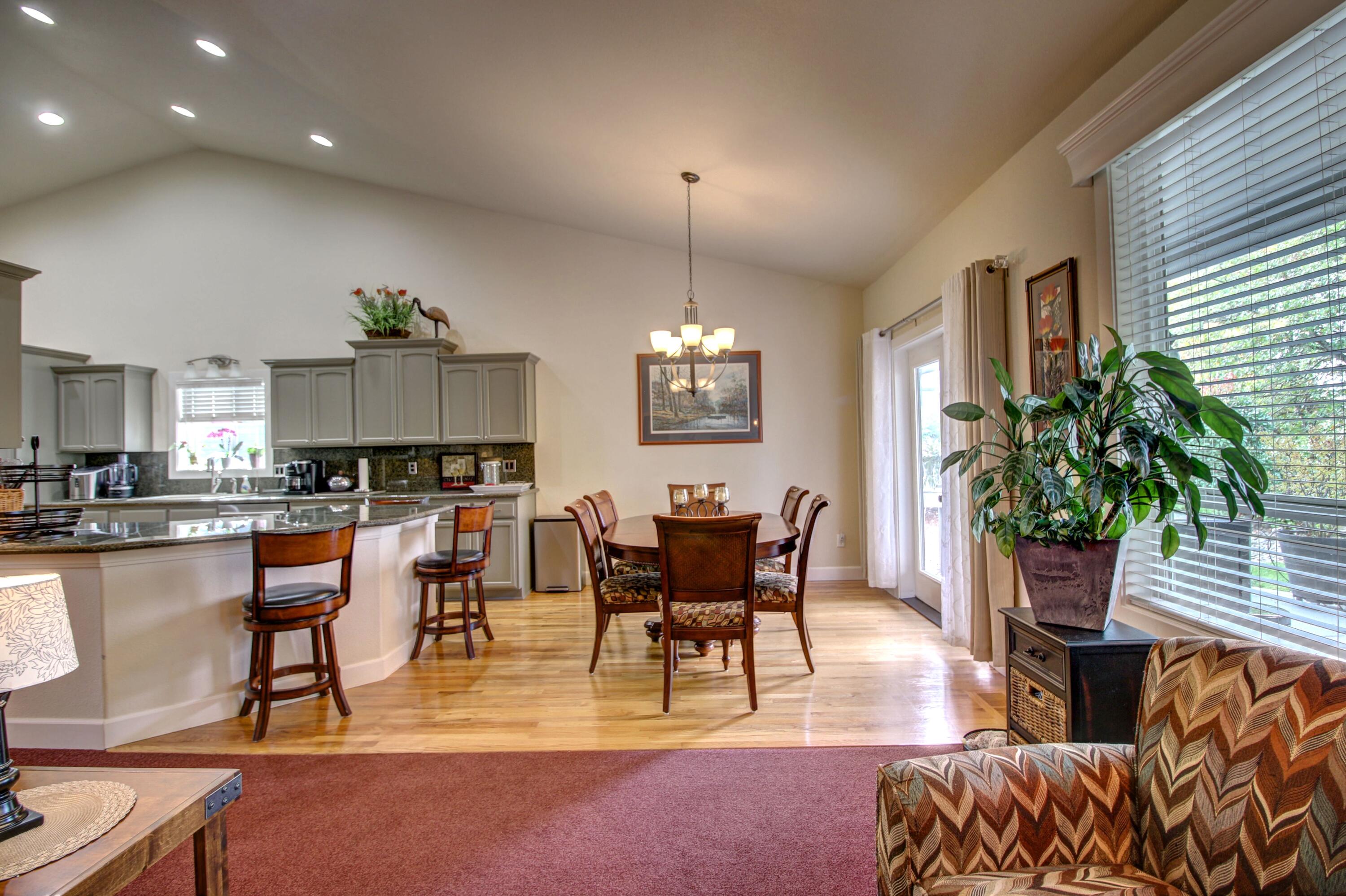 33 Broken Stone Way Eagle Point, OR 97524 - Photo 14 of 33 a view of a dining room with furniture window and wooden floor