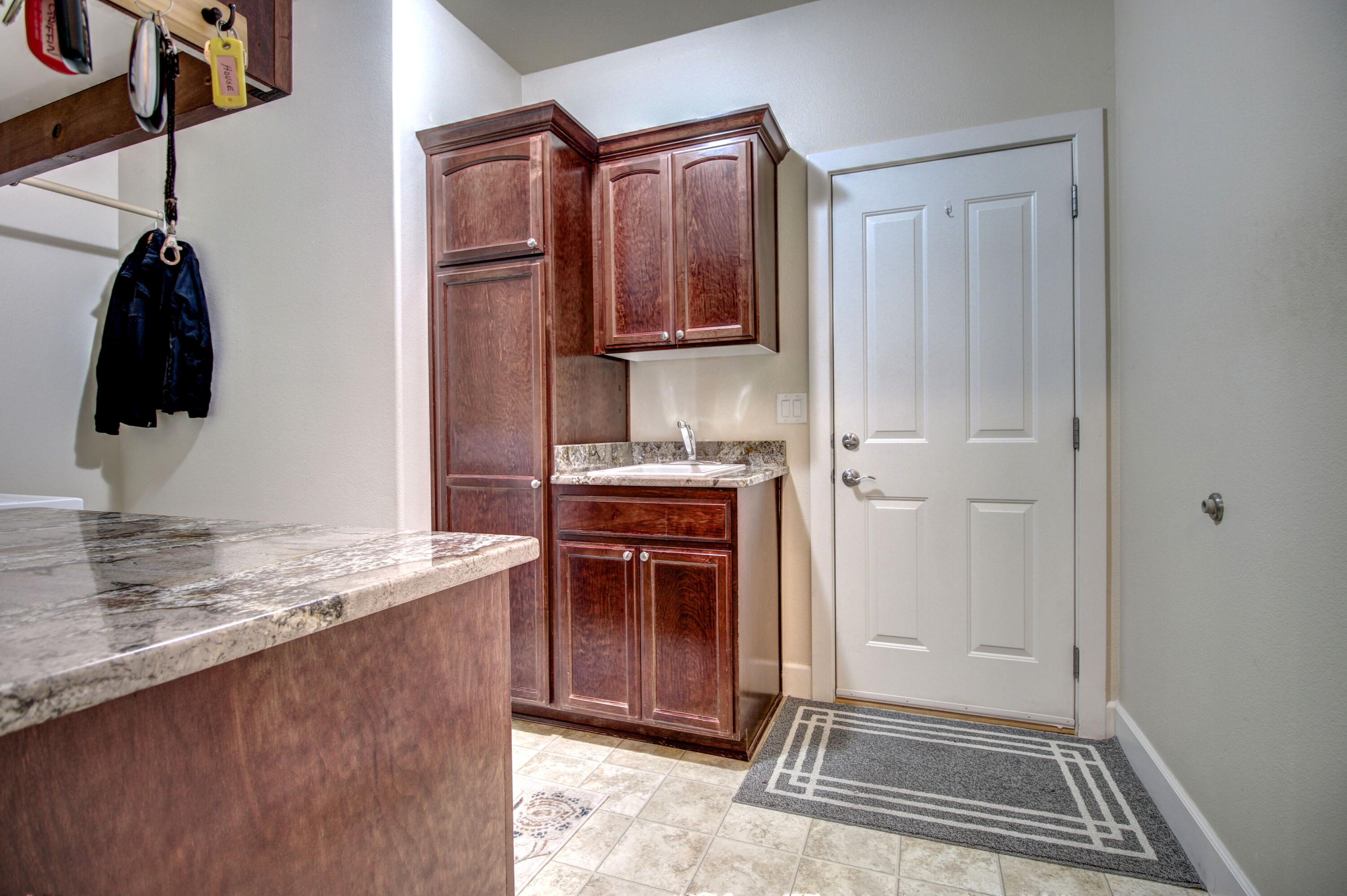 33 Broken Stone Way Eagle Point, OR 97524 - Photo 22 of 33 a kitchen with a refrigerator and a stove top oven