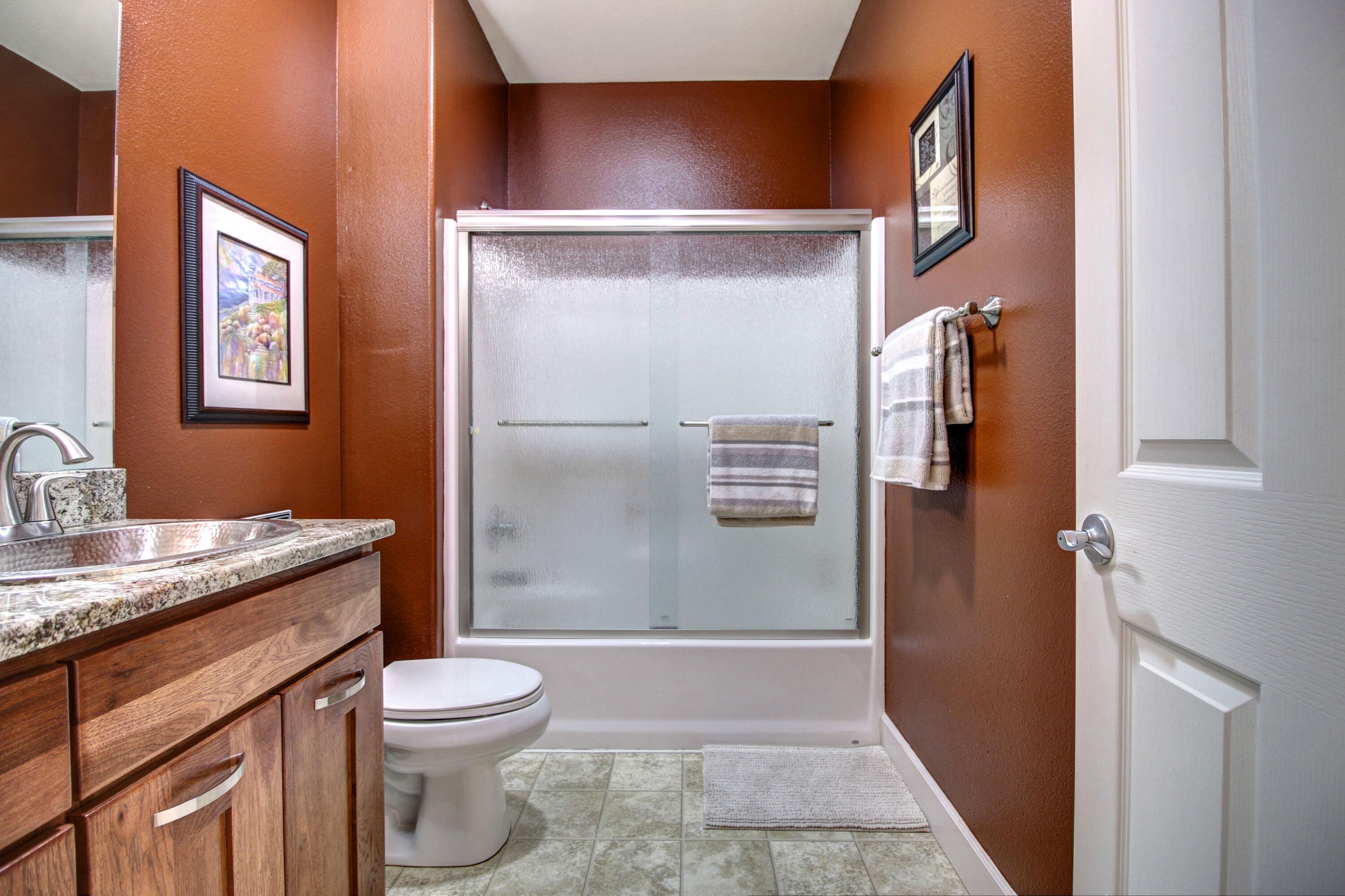 33 Broken Stone Way Eagle Point, OR 97524 - Photo 24 of 33 a bathroom with a granite countertop sink toilet and shower