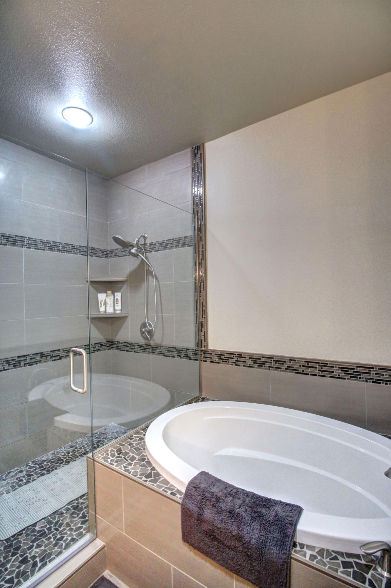 33 Broken Stone Way Eagle Point, OR 97524 - Photo 28 of 33 a bathroom with a bathtub and shower