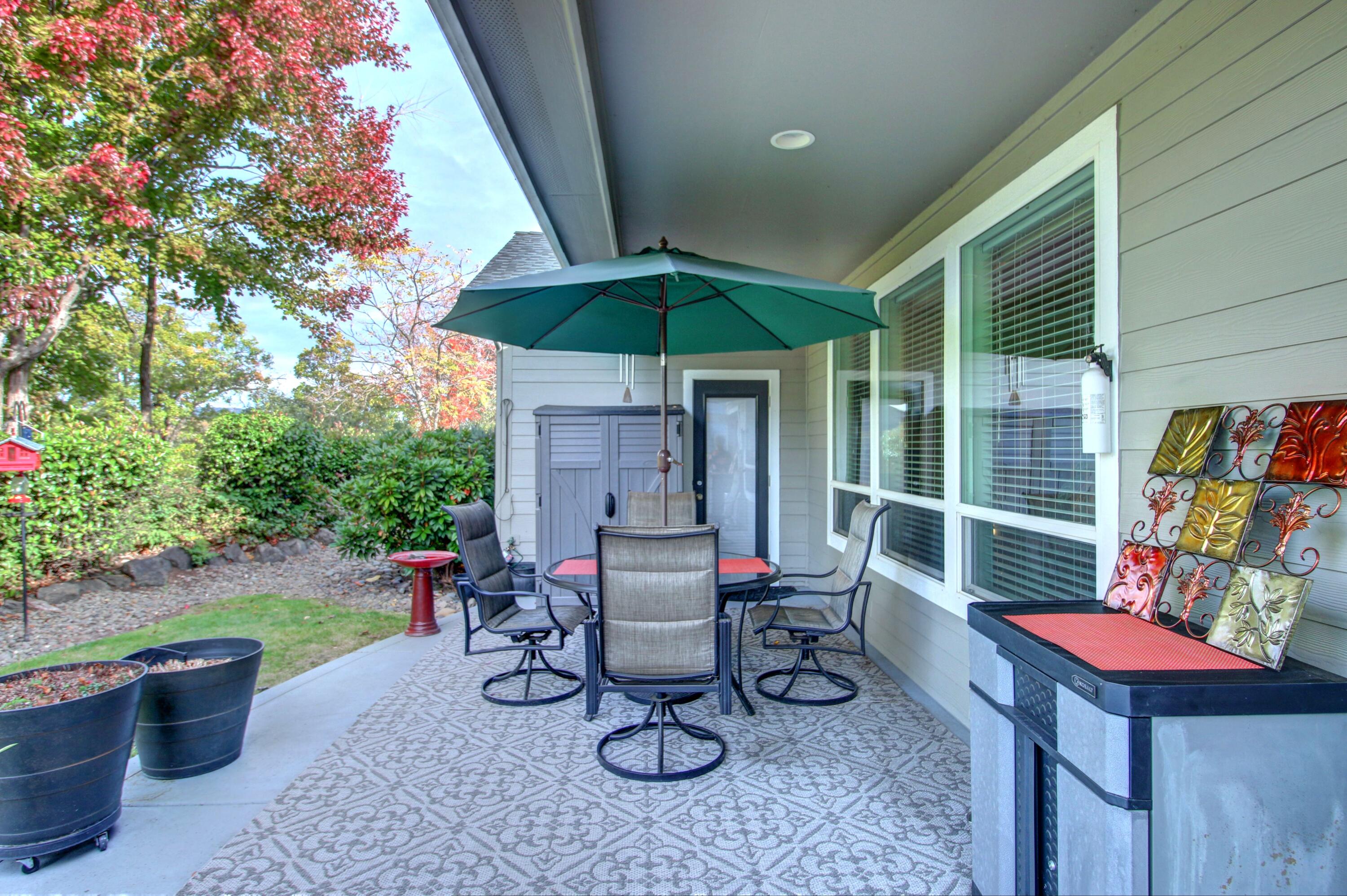 33 Broken Stone Way Eagle Point, OR 97524 - Photo 32 of 33 a view of a patio with chairs and potted plants