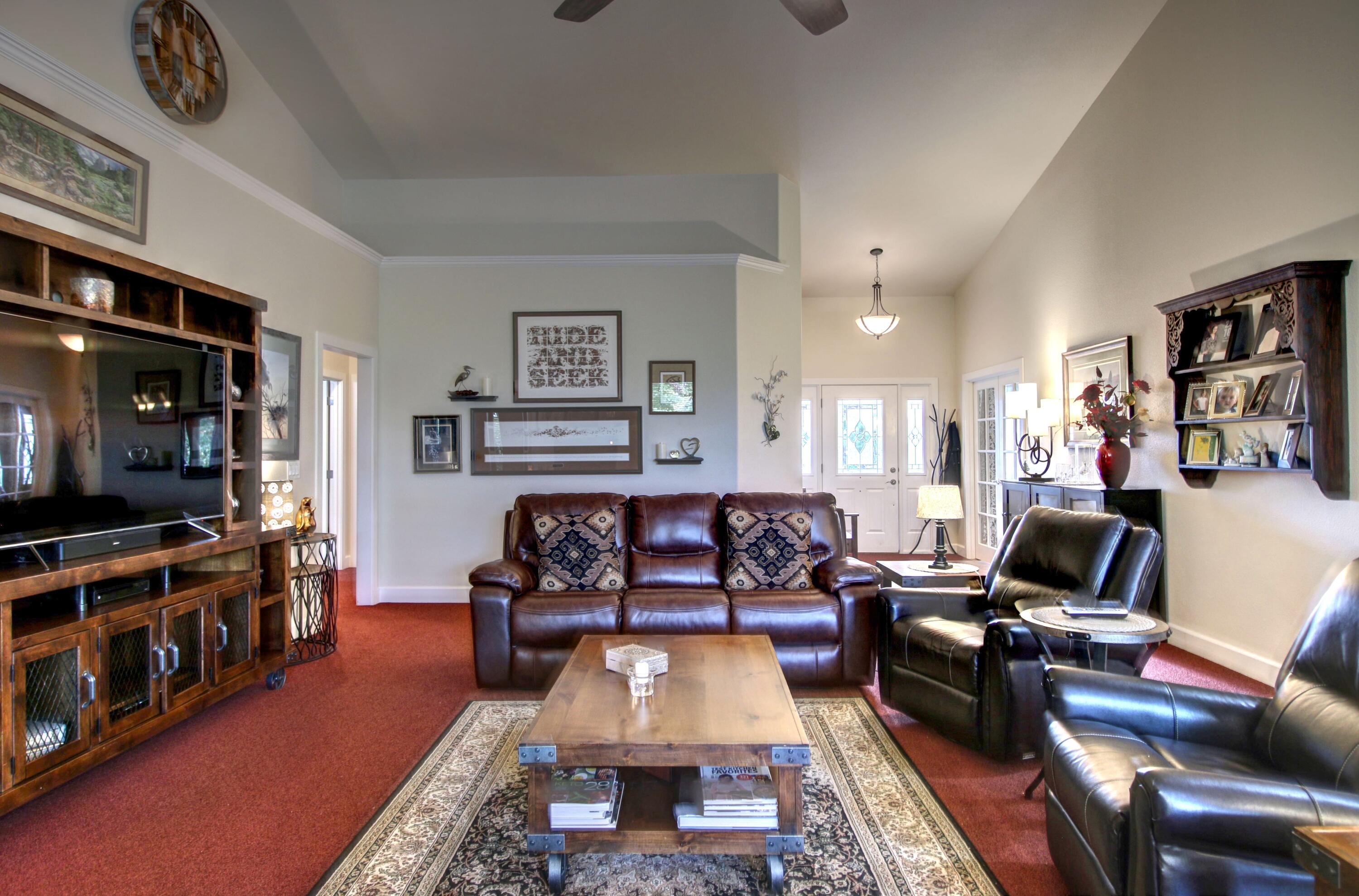 33 Broken Stone Way Eagle Point, OR 97524 - Photo 8 of 33 a living room with furniture and a flat screen tv