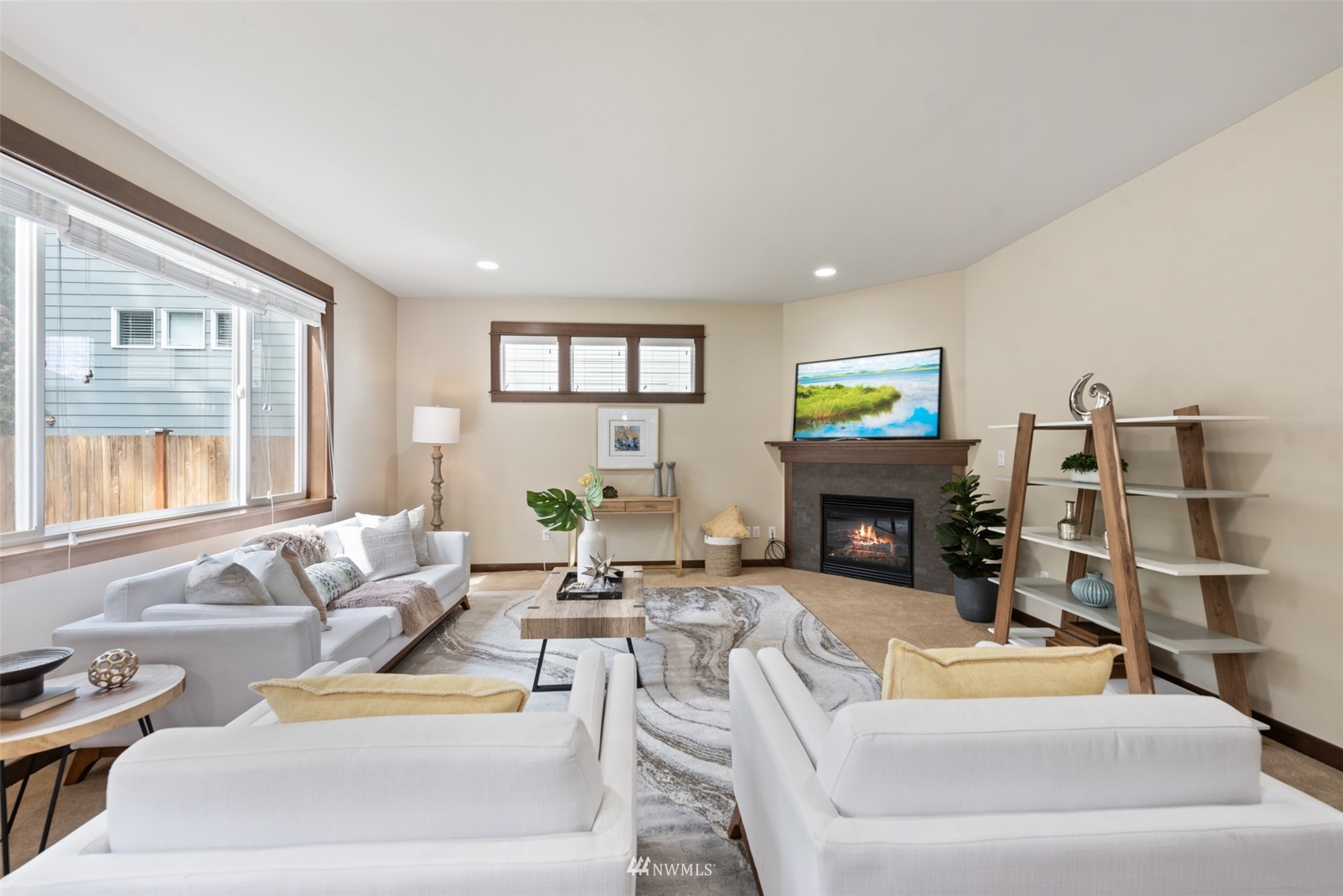 23010 19th Place West Bothell, WA 98021 - Photo 3 of 28 a living room with furniture and a fireplace