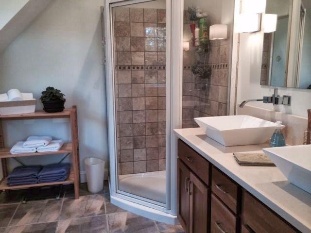 10 Pleasant Cove Road Boothbay, ME 04537 - Photo 10 of 17 tiled bathroom with exquisite fixtures
