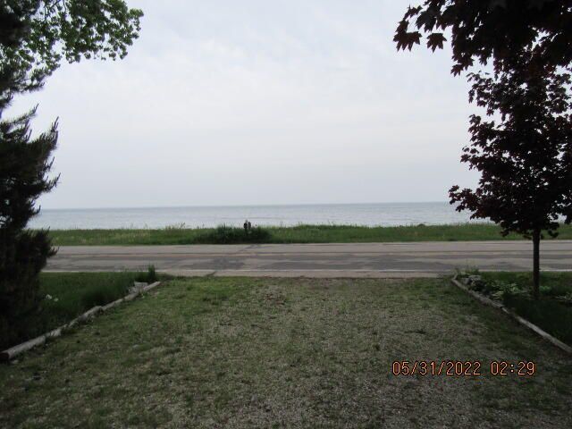 Undisclosed Address Pleasant Prairie, WI 53158 - Photo 2 of 13 a view of lake with green field
