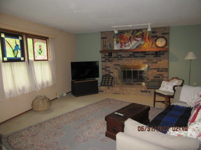 Undisclosed Address Pleasant Prairie, WI 53158 - Photo 4 of 13 a living room with furniture and a fireplace