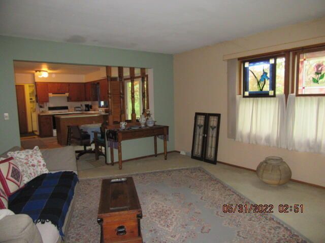 Undisclosed Address Pleasant Prairie, WI 53158 - Photo 7 of 13 a living room with furniture and a flat screen tv