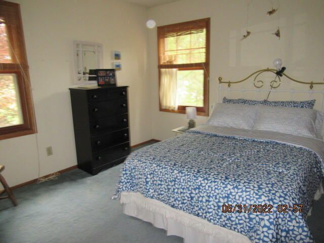 Undisclosed Address Pleasant Prairie, WI 53158 - Photo 9 of 13 a bed room with a bed and a window