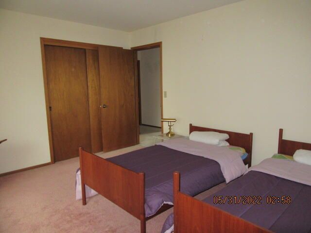 Undisclosed Address Pleasant Prairie, WI 53158 - Photo 10 of 13 a bedroom with two beds and a closet