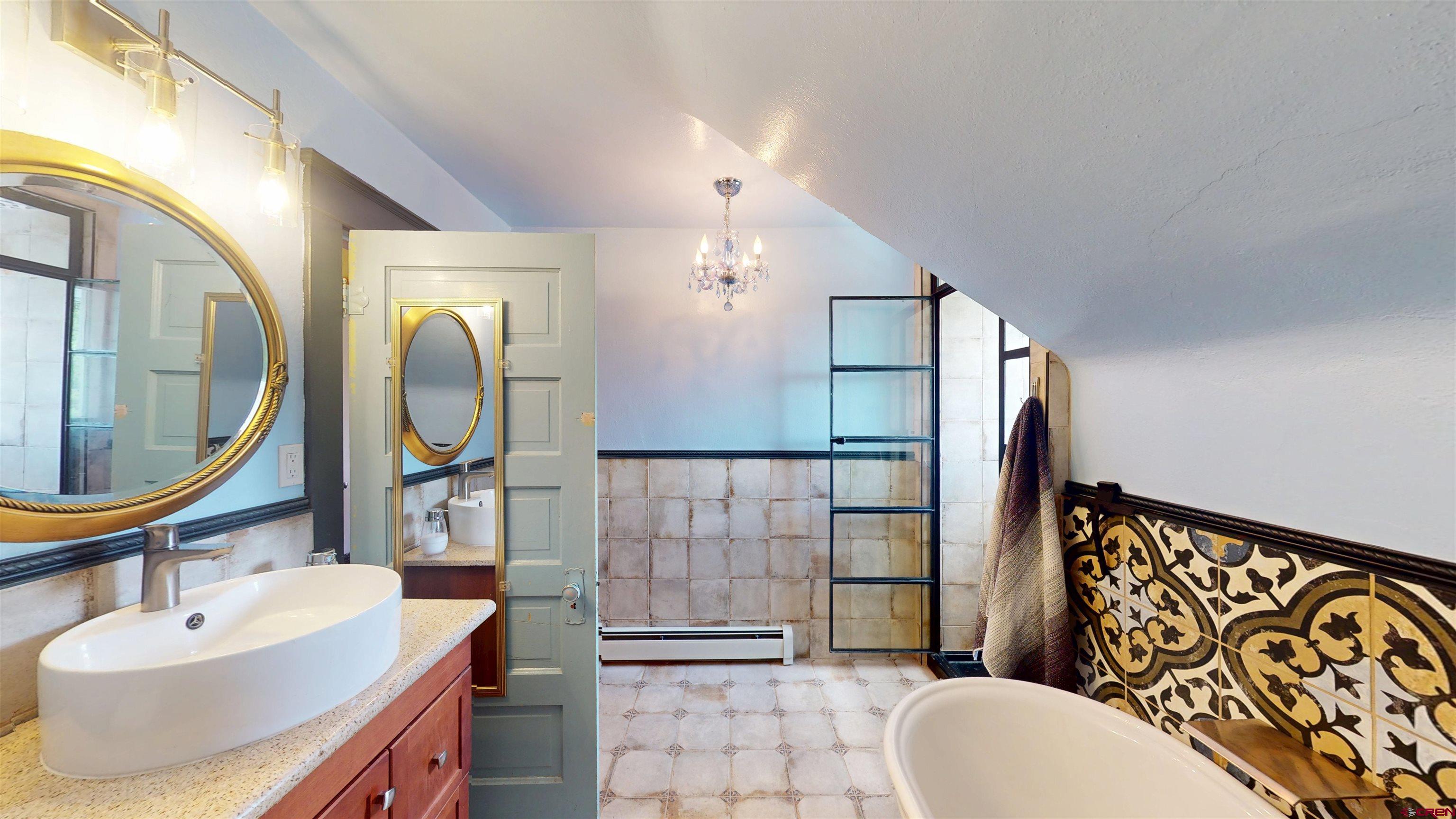 39778 Pitkin Road Paonia, CO 81428 - Photo 22 of 45 a bathroom with a sink a toilet and shower
